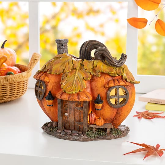 Glitzhome® 8.5" Lighted Fall Resin Pumpkin House Table Decor with Timer